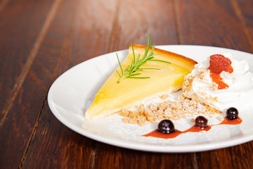 Fresh tasty lemon tart with crumble and whipped cream