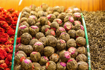 Fototapeta na wymiar Dried flowers of green tea on the counter