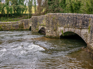 Fototapeta na wymiar Sheepwash Bridge over the River Wye, Ashford in the Water, Derbyshire. Claimed to be the most photographed bridge in the UK
