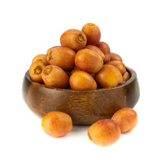 Bunch of yellow raw Date Fruit or Medjool Dates (Phoenix dactylifera) from the palm tree isolated on White Background.Healthy lifestyle and Vegetarian concept