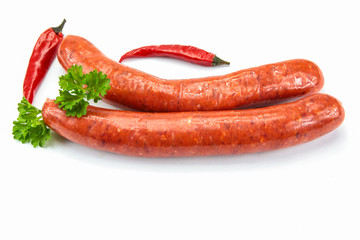 several raw merguez on a white background