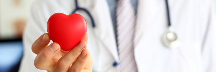 Doc holding heart