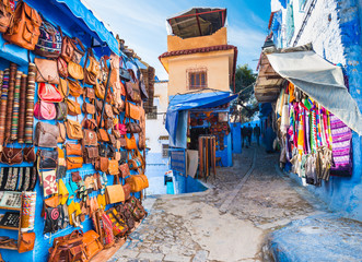 Fototapeta na wymiar Traditional bags, carpets and handicrafts on the street of Chefchaouen, Morocco