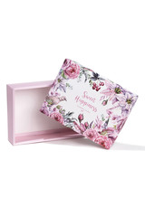 Subject shot of a white gift box with a white bottom and a lid decorated with colorful floral tropic print, design with letters and a pleasant text: "Sweet happiness. You deserve the best."
