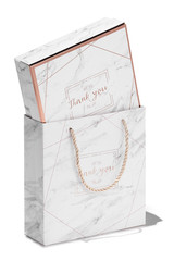 Subject shot of a gift box in a bag with plaited handles. Both items are decorated with grayish mottled print with goldish lines and and a pleasant text: "Thank you. Join us. Good time to meet you."