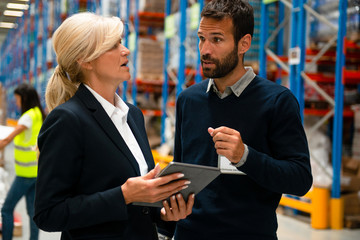 Managers in Warehouse discuss about business