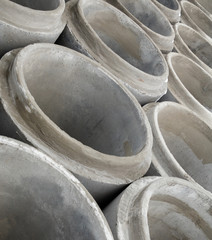 Stack of new concrete pipes.