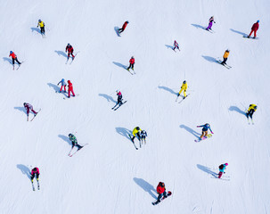 Background of many skiers and snowboarders. Winter sports - Powered by Adobe