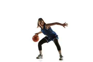 Young caucasian female basketball player of team in action, motion in run isolated on white...