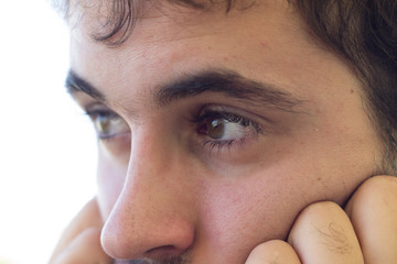 Close-up of Caucasian boy with clear eyes. Focus on the eyes. 