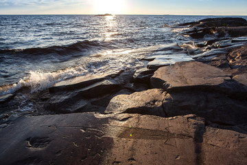 ancient rock carvings petroglyphs on the shore of Onega Lake carved on a granite plate . Age of...