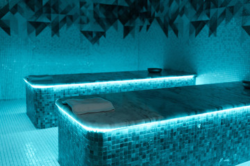 hammam tables with blue lights in spa salon