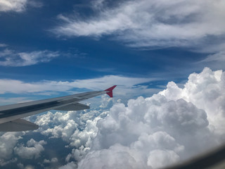 Fototapeta premium Airplane Window View of Wing and clear blue sky