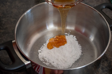 Do it yourself: Gingerbread cookies tutorial. Step by step recipe. Step 02. Put powdered sugar and honey in a saucepan