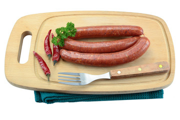 several merguez on a cutting board