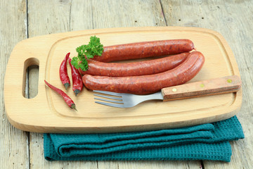 several merguez on a cutting board