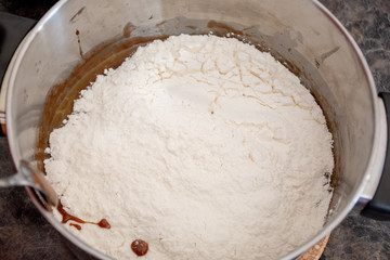 Do it yourself: Gingerbread cookies tutorial. Step by step recipe. Step 10. Stir in all fluor until it forms a dough