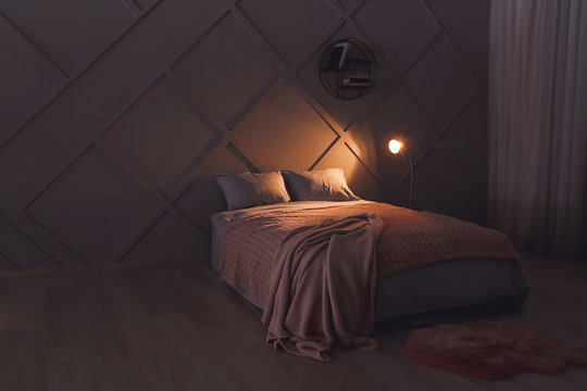 Stylish Interior Of Bedroom At Night