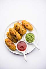 Veg Poha Roll made using flattened Rice, served with tomato ketchup and green chutney