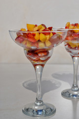 Perfect fruit salad with drops of honey. Mix fresh strawberry, peach fruit and grape. Festive dessert perfect match  for any holiday 