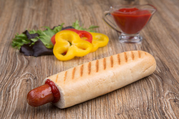 french hot dog with paprika and ketchup