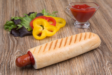 french hot dog with paprika and ketchup