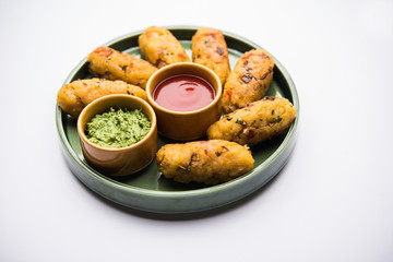 Veg Poha Roll made using flattened Rice, served with tomato ketchup and green chutney