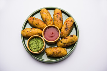 Veg Poha Roll made using flattened Rice, served with tomato ketchup and green chutney
