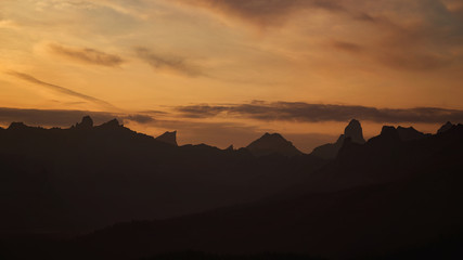 outline of mountains in shadow at dawn