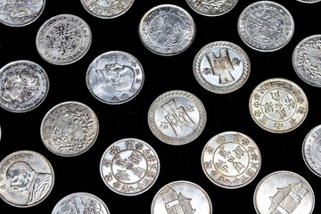 Close Up of Silver Chinese Coins Cash