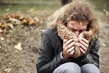 Portrait of poor homeless man outdoors