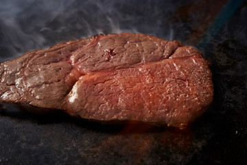 Beef steak on hot iron plate