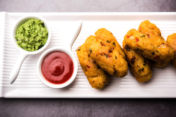 Veg Poha Roll made using flattened Rice, served with tomato ketchup and green chutney