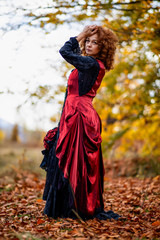 Fototapeta na wymiar Portrait of a mature lady in a vintage dress, autumn time.