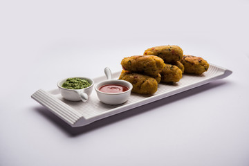 Veg Poha Roll made using flattened Rice, served with tomato ketchup and green chutney