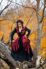 Fototapeta premium Portrait of a mature lady in a vintage dress, autumn time.