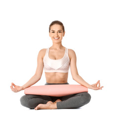 Beautiful young woman practicing yoga on white background