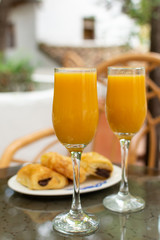 Healthy breakfast with two glasses of freshly squeezed orange juice