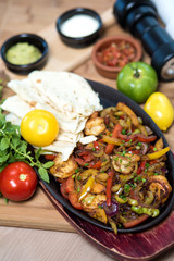 stir-fried shrimp with vegetables served with flatbread