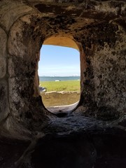 window, stone, old, landscape, castle, sea, nature, sky, arch, wall, architecture, rock, blue, view, travel, ancient, water, ruins, ocean, door, building, tunnel, summer, open, beach