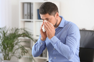 Man ill with flu working in office