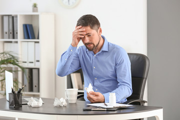 Man ill with flu working in office