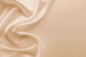  Beautiful smooth elegant wavy beige / light brown satin silk luxury cloth fabric texture, abstract background design. Copy space. Card or banner © Sindija