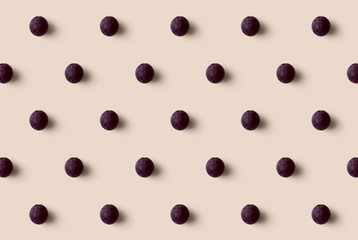 Grape pattern isolated on soft orange background. Fresh fruit.