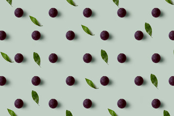 Grape pattern isolated on blue background. Fresh fruit.