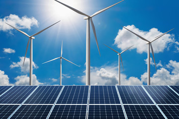 concept clean energy power. solar panel with wind turbine and blue sky background