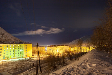 Obraz premium Night city in the mountains 