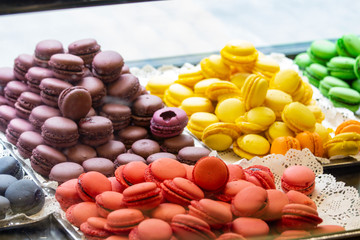 Colorful macarons in showcase, patisserie, sweetshop