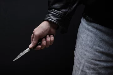 Foto op Plexiglas Man brandishing knife in a threatening manner. © Kevin Brine