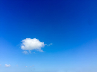 Blue sky with small cloud.